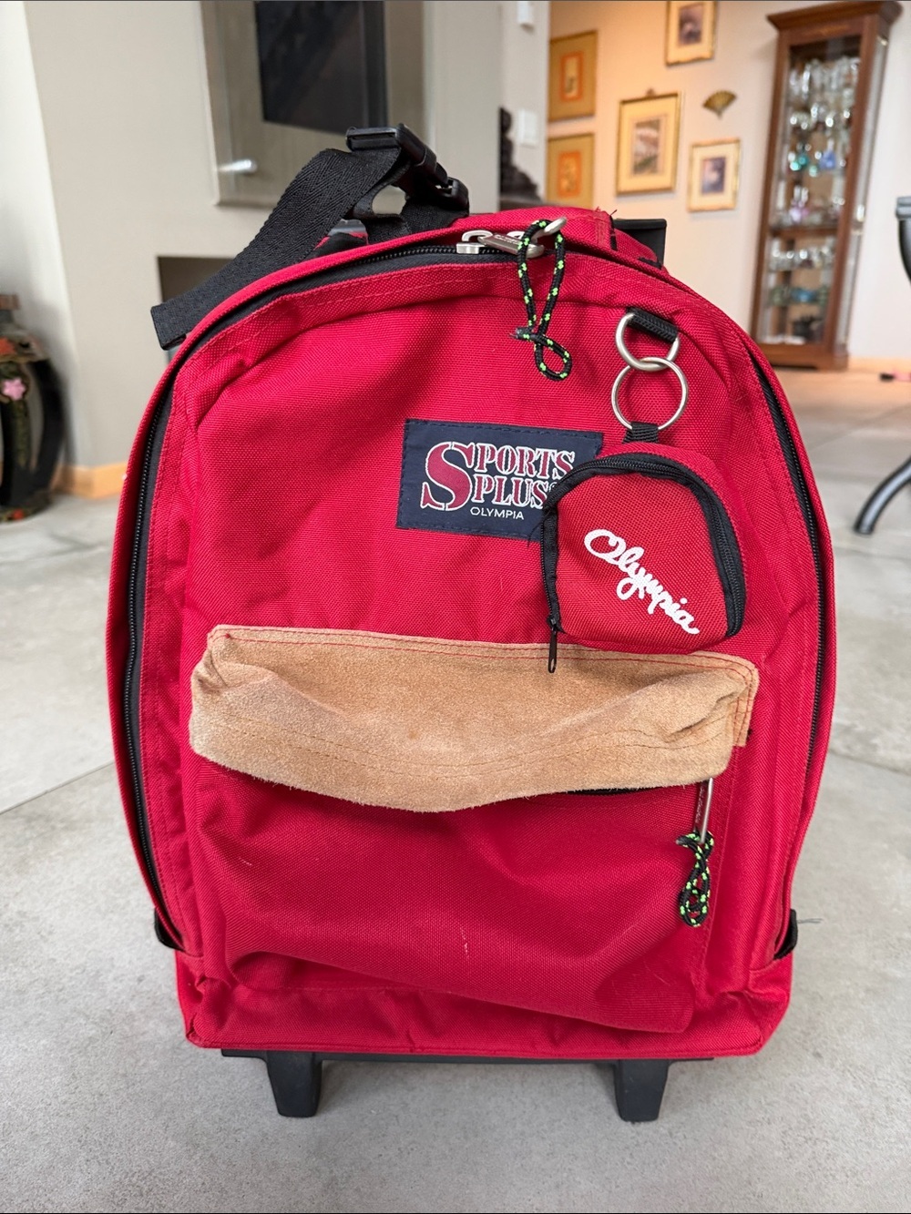 Olympia Sports Plus Red Rolling Backpack